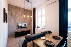Telewizja i/lub zestaw kina domowego w obiekcie Ottimo Apartamenty Jagiellońska