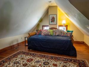 a bedroom with a bed in a stair room at Wren Retweet in Chestertown