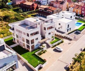 an aerial view of a large white house at Volme Resort in Banjole