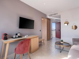 TV a/nebo společenská místnost v ubytování M City Hotel
