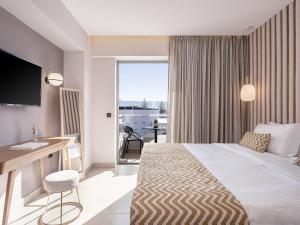 Postel nebo postele na pokoji v ubytování M City Hotel