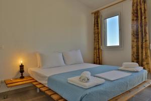 Ένα ή περισσότερα κρεβάτια σε δωμάτιο στο Litochoro Combo Apartments