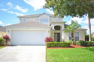 a large white house with a garage at Ainsdale Haven home in Kissimmee