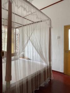 Postel nebo postele na pokoji v ubytování Wasana Ocean View Villa Mirissa