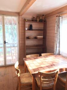 a dining room with a table and chairs at Chaty U Žabáka in Netolice