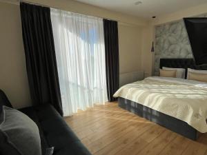 Ένα ή περισσότερα κρεβάτια σε δωμάτιο στο Delux apartment for 6 guest, new gudauri