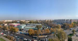 an aerial view of a city with a parking lot at Студия в ЖК Ушсункар in Almaty