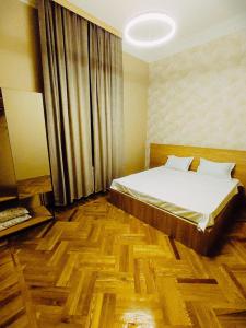 Postel nebo postele na pokoji v ubytování Happy Stay Hotel