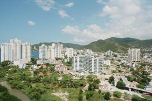 a large city with tall buildings and the ocean at Edificio Reserva del Mar, apartamentos 1618, 1614 y 1714 in Santa Marta