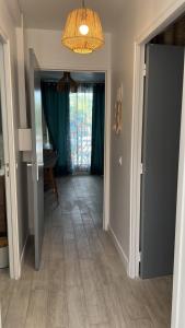 a hallway with a door open to a room at Appartement Blue Lagon in Saint-François +9 photos