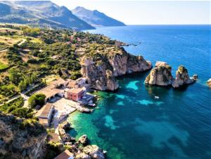 an aerial view of a rocky island in the ocean at Casa Vacanza Brigida in Scopello +8 photos