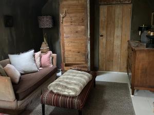 Llit o llits en una habitació de De Schuilhoek Private Guesthouse