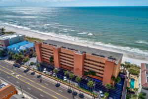 an aerial view of a building next to the beach at Villa Madeira 410 in St Pete Beach