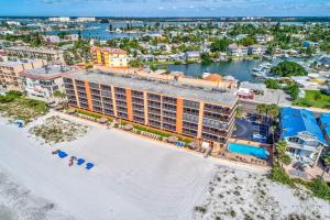 an aerial view of the resort with a beach and buildings at Villa Madeira 410 in St Pete Beach
