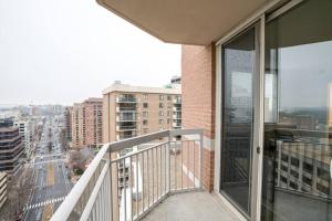 an apartment balcony with a view of a city at Fantastic 2 BR Condo at Ballston With City View in Arlington