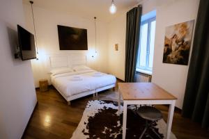 Ένα ή περισσότερα κρεβάτια σε δωμάτιο στο La Stazione degli Artisti