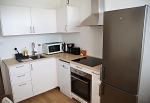 Fotografia z galérie ubytovania Bergson Top - Appart 80m2, 2 grandes chambres, entièrement rénovée et équipée, lumineux, WIFI, balcon, calme, vue imprenable v destinácii Saint-Étienne