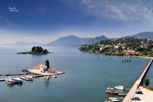 a view of a body of water with boats in it at Alex Apartment Suites in Virós