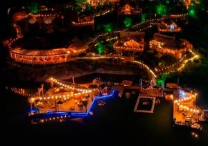an aerial view of a garden at night with lights at Atma Eco Village in Guatapé