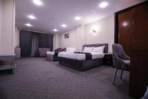 Postel nebo postele na pokoji v ubytování Royal Hotel Assiut