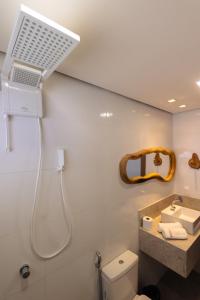 a bathroom with a shower and a sink at Casa Sirenia in Cajueiro