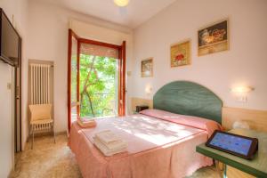 Postel nebo postele na pokoji v ubytování Albergo Villa Lucia