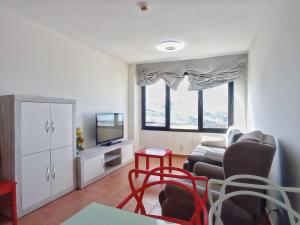 TV a/nebo společenská místnost v ubytování Apartamento familiar