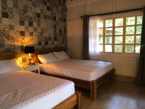 Postel nebo postele na pokoji v ubytování Hotel Villas Gaia Ecolodge