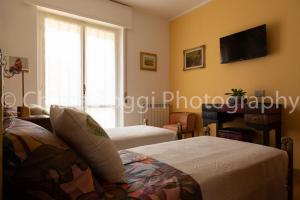 Postel nebo postele na pokoji v ubytování Ghe Sem Morazzone B&B