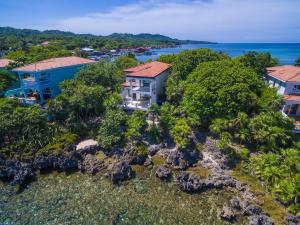 an aerial view of a house on a rocky island at Coral Vista #4 - 50546 Home in West End