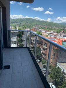 a balcony with a view of a city at Loft EL JAZMÍN in San Salvador de Jujuy