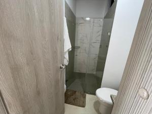 a bathroom with a toilet and a shower at DIMALU LOFT in Roldanillo