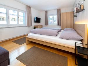 Postel nebo postele na pokoji v ubytování Haus Andrea
