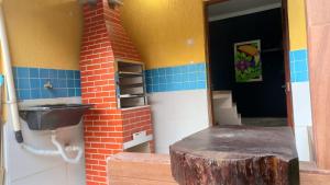 a lego house with a sink and a tree stump at Casas Jacatirão in Ubatuba +43 photos