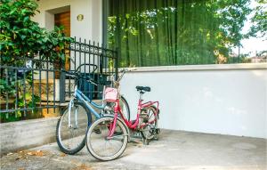 two bikes are parked next to a building at Casa Luisa in Gabicce Mare
