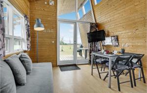 a room with a desk and a table with chairs at Pet Friendly Home In Kolding With House A Panoramic View in Kolding