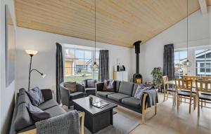 a living room with two couches and a table at Stunning Home In Gråsten With Wifi in Gråsten