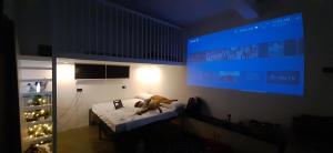 a teddy bear sitting on a bed in a room at La Minimalista in Bagac