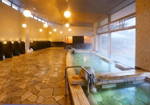 a indoor hot tub in a hotel room at Greenpia Yame in Yame +32 photos
