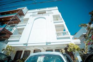 a building with a car parked in front of it at ASHOK VILLA in Jaipur