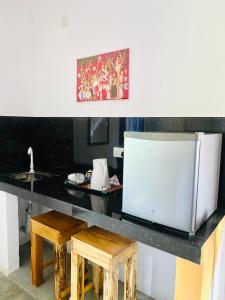 Kuchyň nebo kuchyňský kout v ubytování Coconut Reach