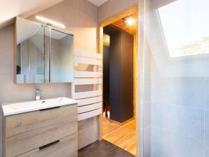 a bathroom with a sink and a mirror at Chalet typique rénové à Soulan, 4 chambres, 9 pers. - FR-1-296-349 in Saint-Lary-Soulan +7 photos
