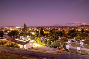 an aerial view of a town at night at BIG4 Launceston Holiday Park in Launceston