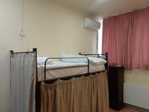 Ein Bett oder Betten in einem Zimmer der Unterkunft Wine Hostel