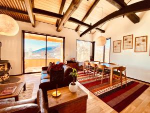 a living room with a couch and a table at Snowman Apartments at Madarao Mountain in Iiyama