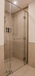 a shower with a glass door in a bathroom at AYA Boutique - Rahaal 2, Madinat Jumeirah Living in Dubai