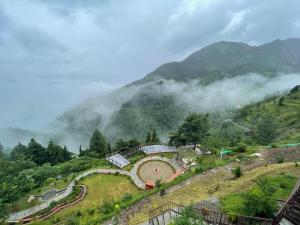 a farm on a hill in the mountains at Atulyam, Pangot in Nainital +21 photos