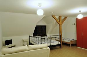 Postel nebo postele na pokoji v ubytování Apartmány pod lípou