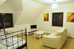 Postel nebo postele na pokoji v ubytování Apartmány pod lípou