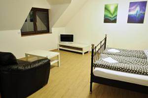 Postel nebo postele na pokoji v ubytování Apartmány pod lípou